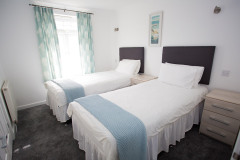 Twin-Beds-in-bedroom-contemporary-cottages-Atlantic-Reach