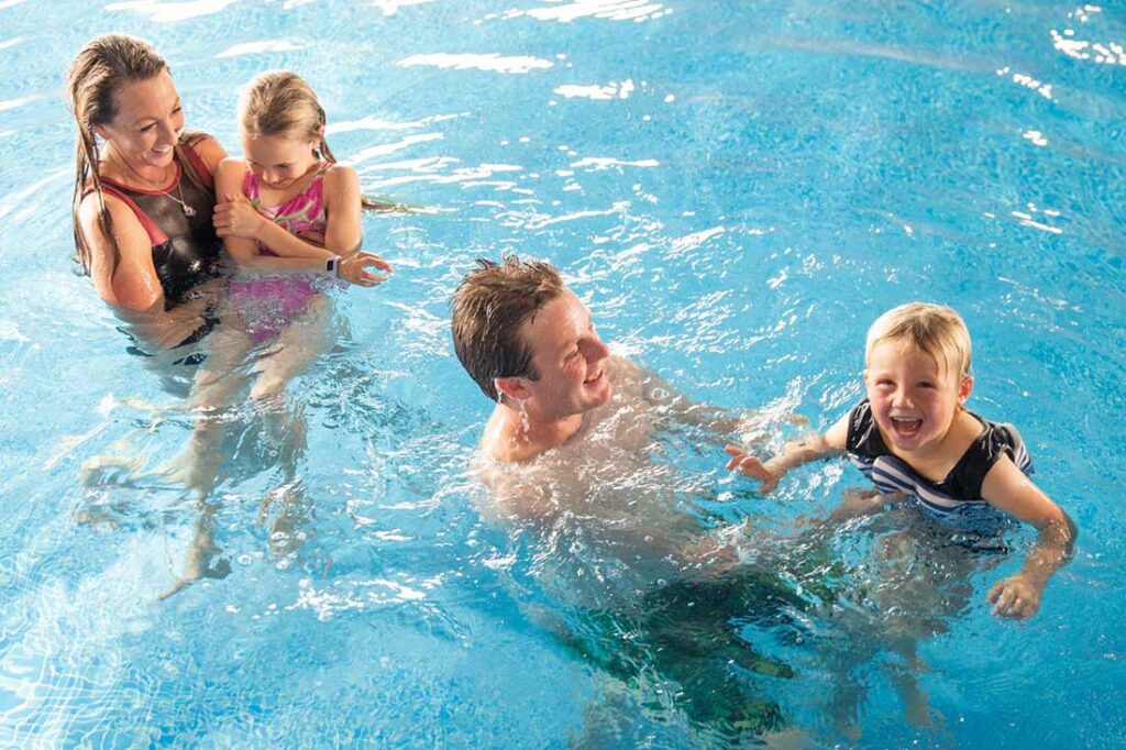 Family having fun together in the swimming pool at Atlantic Reach
