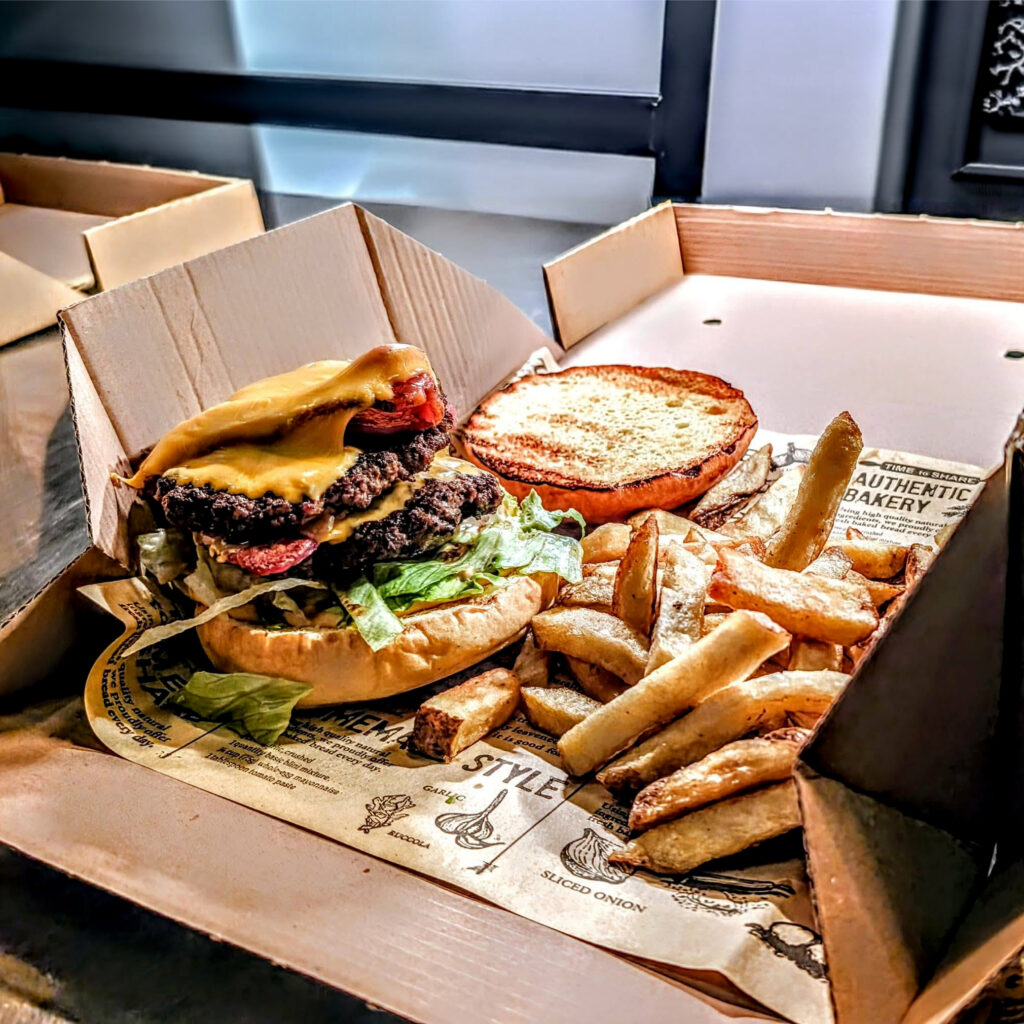 Burger and loaded fries at The Manor Sports Bar during Halloween half-term in Cornwall