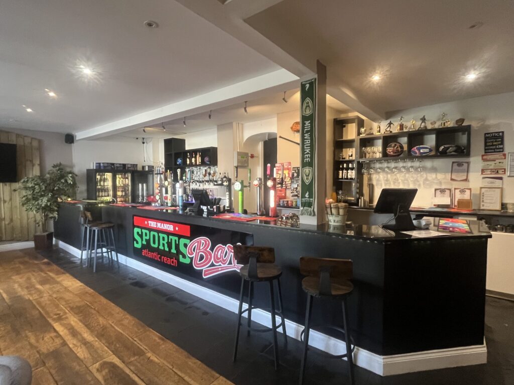 Bar and seating inside the onsite sports bar at Atlantic Reach