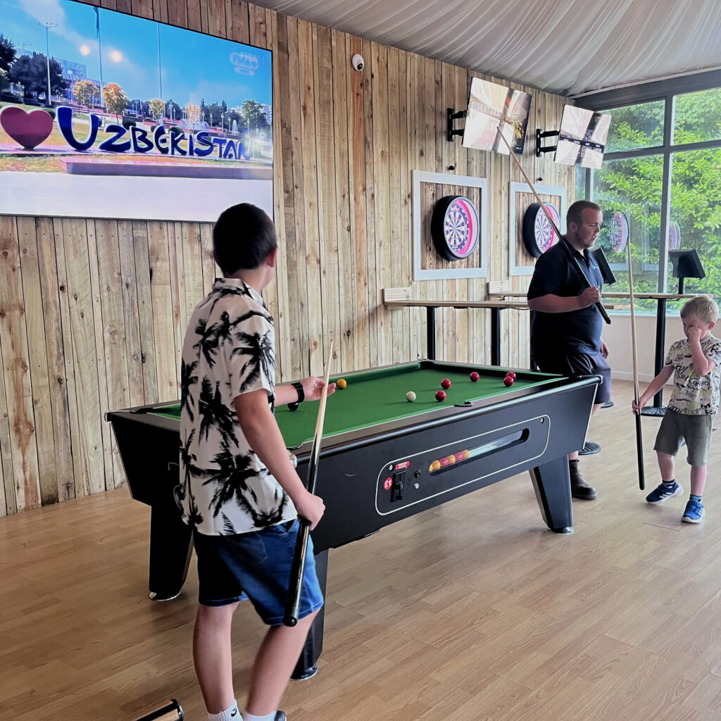Children playing pool at The Manor Sports Bar after a Sunday roast