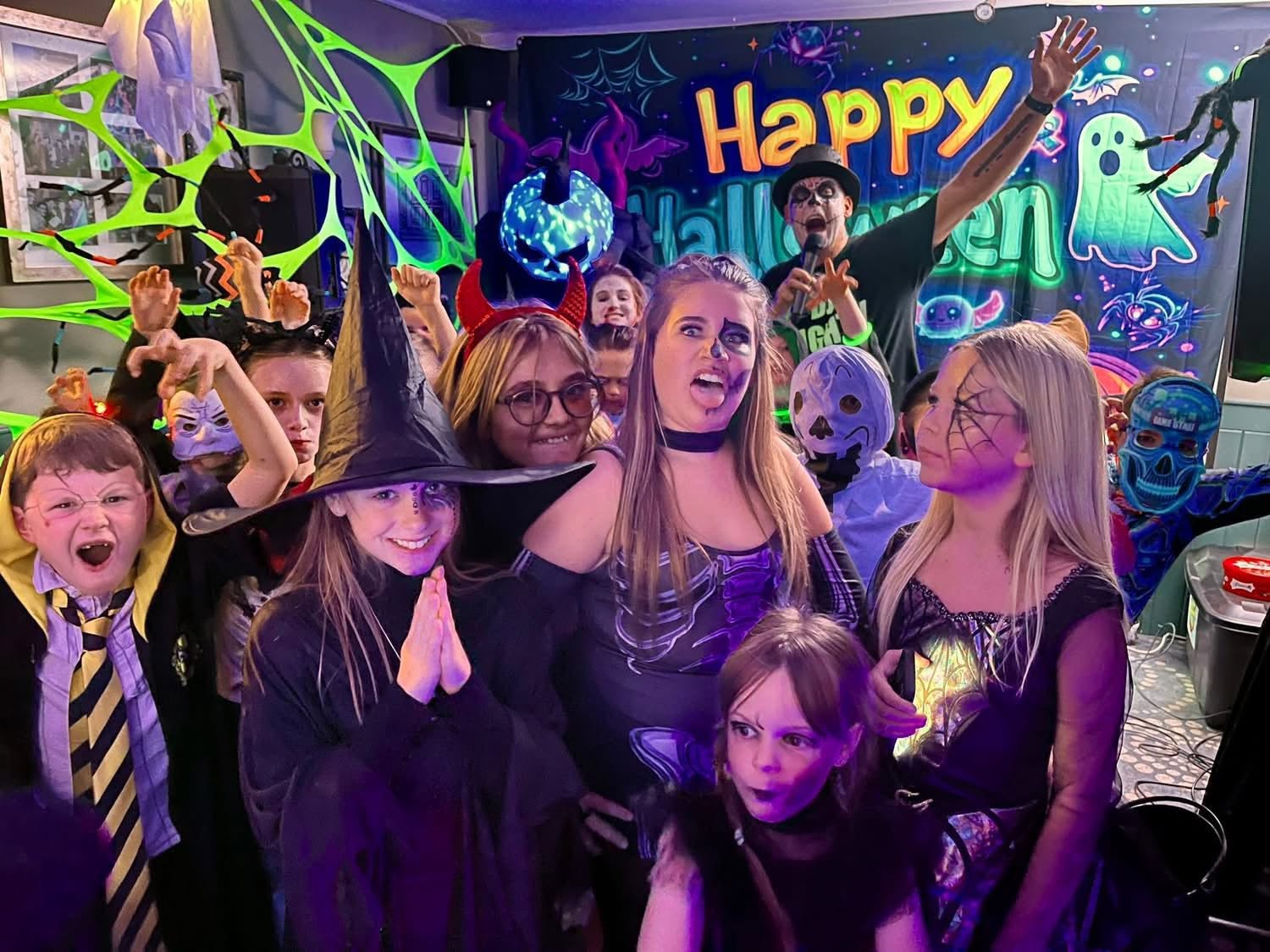 Family enjoying a meal out together during Halloween half-term in Cornwall