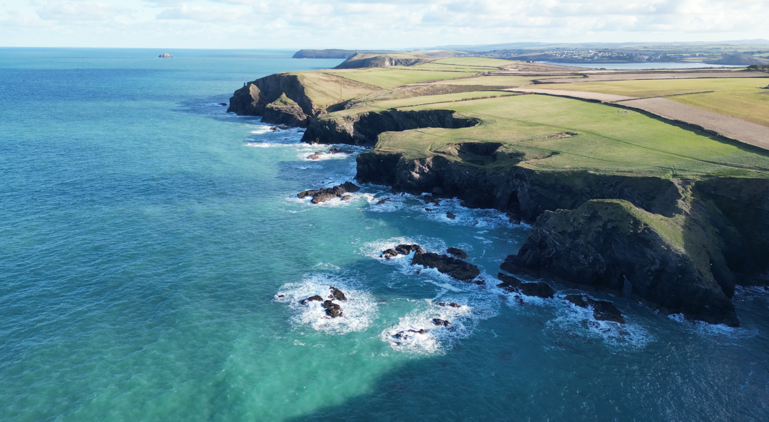 Cliffs and turquoise sea on the Cornish coast in autumn